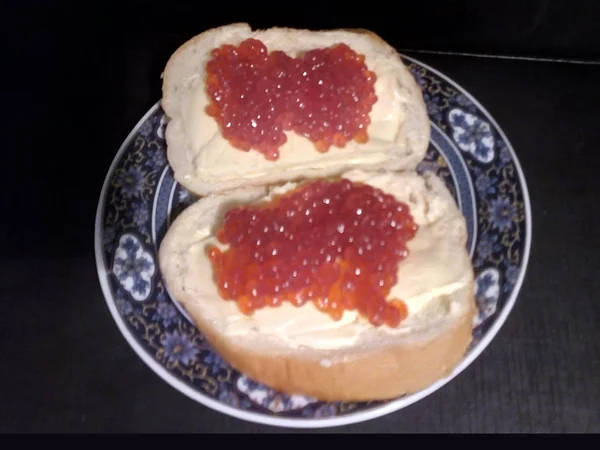 Sandwiches with coho salmon caviar. Red caviar Delicacy from the Far East