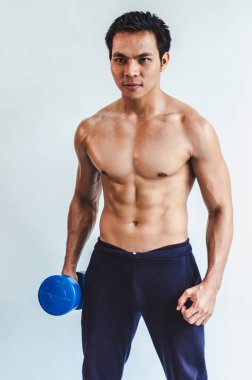 Asian young man with muscular body On the white back