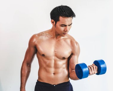 Asian young man with muscular body On the white back