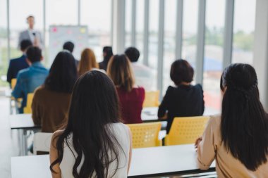 Asian male speaker is speaking at seminars and workshops to the 