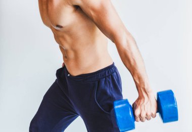 Asian young man with muscular body On the white back