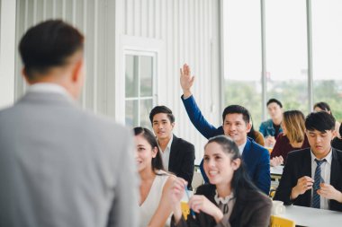 Asian male speaker is speaking at seminars and workshops to the 