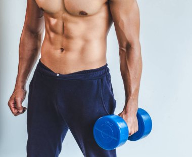 Asian young man with muscular body On the white back