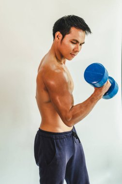 Asian young man with muscular body On the white back
