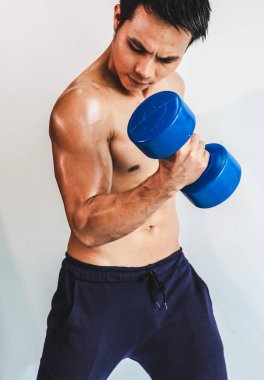 Asian young man with muscular body On the white back