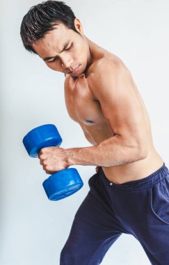 Asian young man with muscular body On the white back