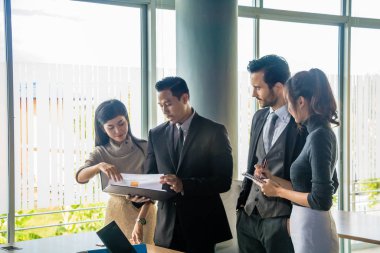 Executives and secretaries are discussing about the job informat