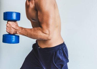 Asian young man with muscular body On the white back