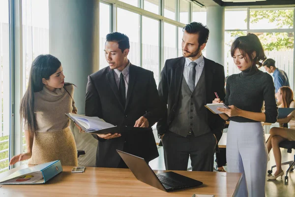 Executives and secretaries are discussing about the job informat