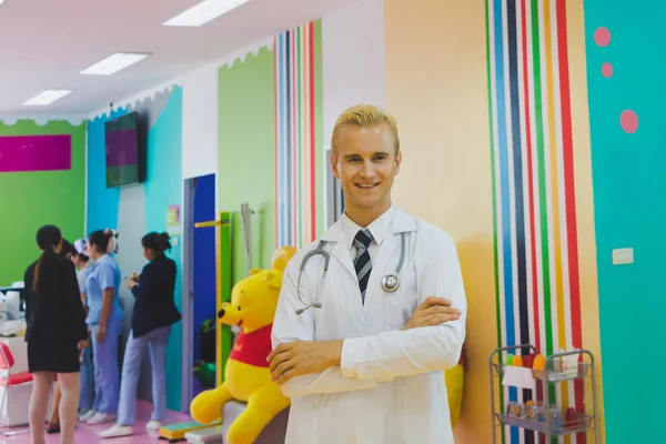 Doctor stands in the hallway of the hospital.