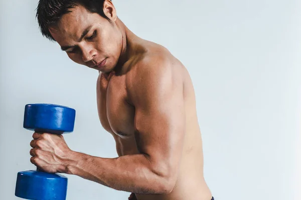 Asian young man with muscular body On the white back — ストック写真