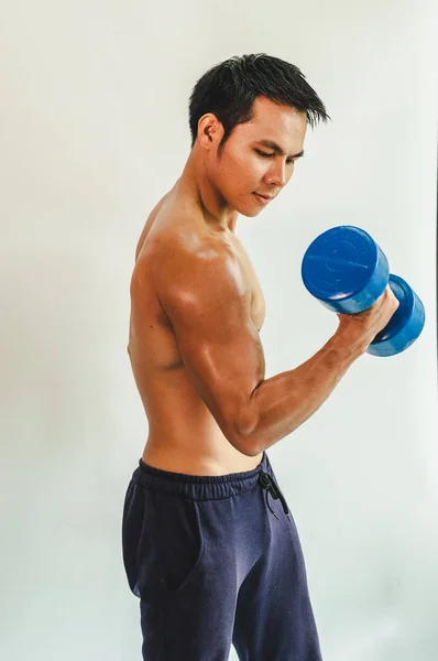 Asian young man with muscular body On the white back — ストック写真