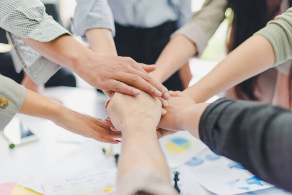 A group of Asian businessmen are discussing their work. Everyone