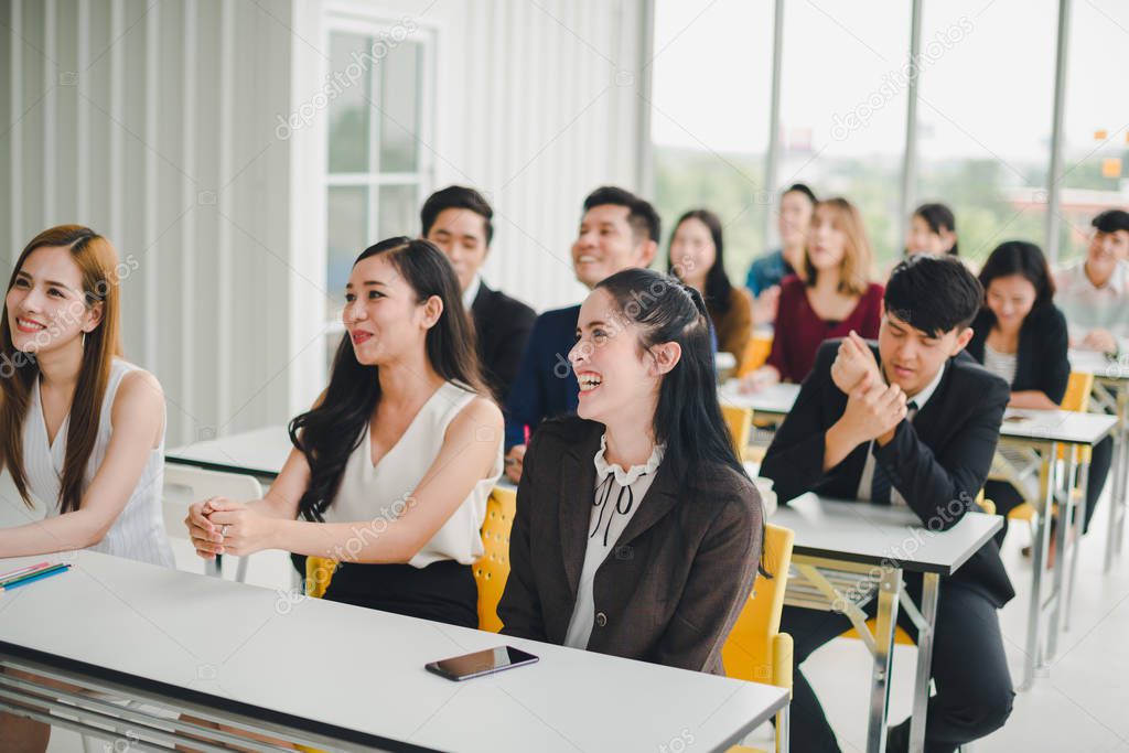 Asian male speaker is speaking at seminars and workshops to the 