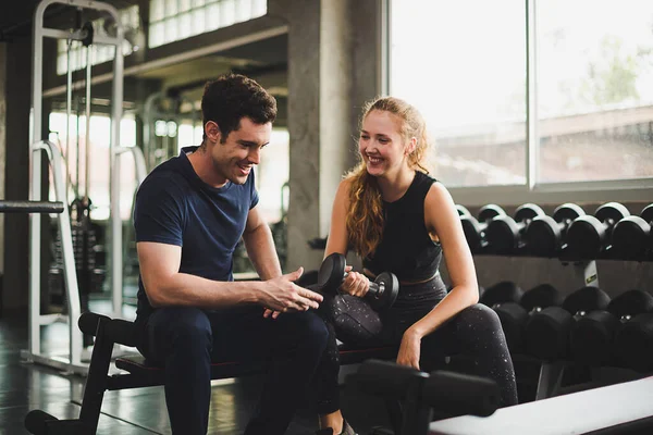 Fitness Trainer is controlling the training of the young women a