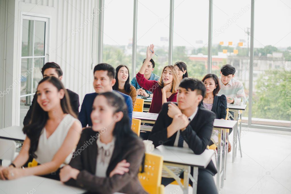 Asian male speaker is speaking at seminars and workshops to the 