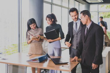 Executives and secretaries are discussing about the job informat