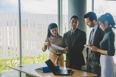 Executives and secretaries are discussing about the job informat