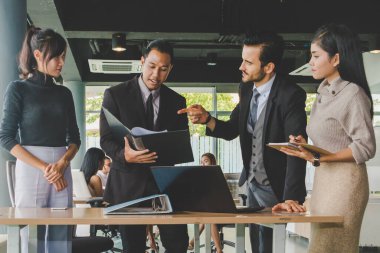 Executives and secretaries are discussing about the job informat