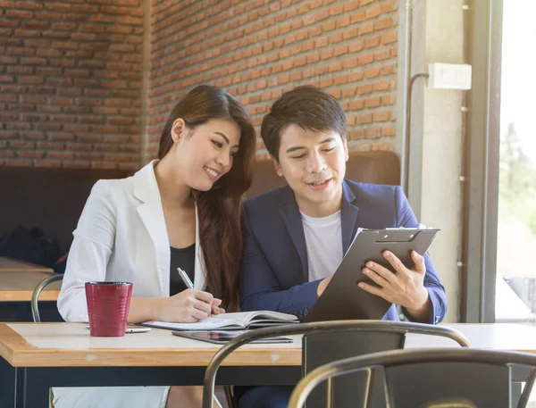 Asian business man and asian business woman.