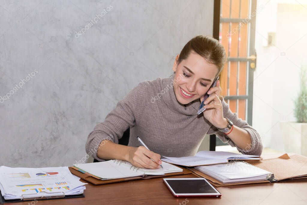 Two women are studying and teaching 