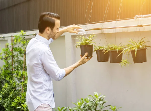 Young man working in the garden — Stock Photo, Image