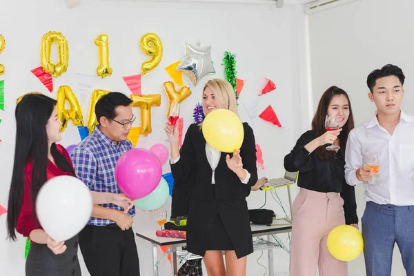 Company Employees of a party to celebrate the New Year 2019 and a DJ at parties. Concept Happy New Year.