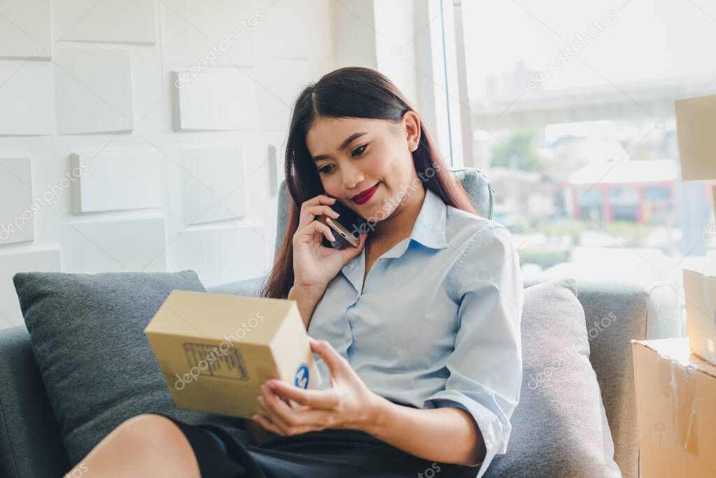 Asian woman startup small business about sme. The girl accepts the order online. By internet and telephone. SME is an independent business concept.