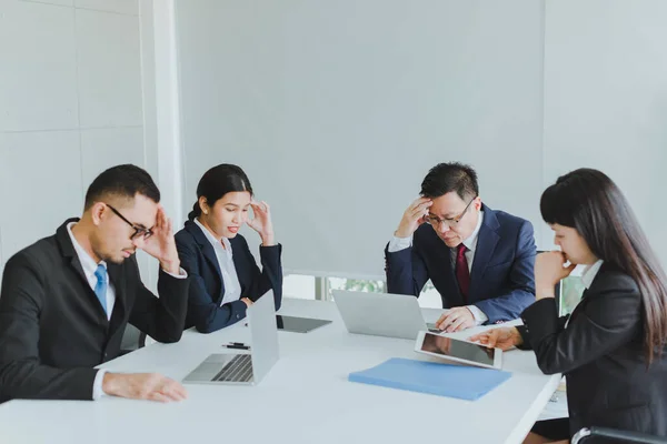 Asian company meetings for presentation as statistical graphs. The business team team consulted each other about the marketing stress.