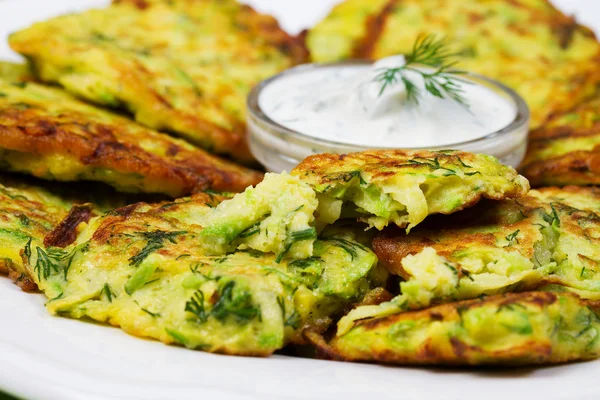 Zucchini Pancakes With  Sour Cream in White Plate. — Stock Photo, Image