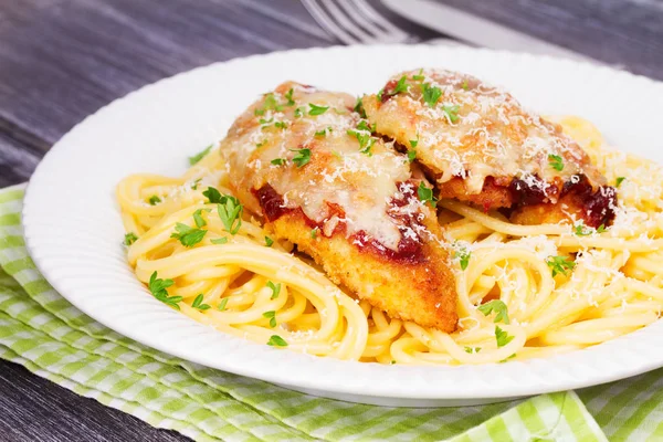 Chicken parmesan and pasta. Chicken breasts and spaghetti