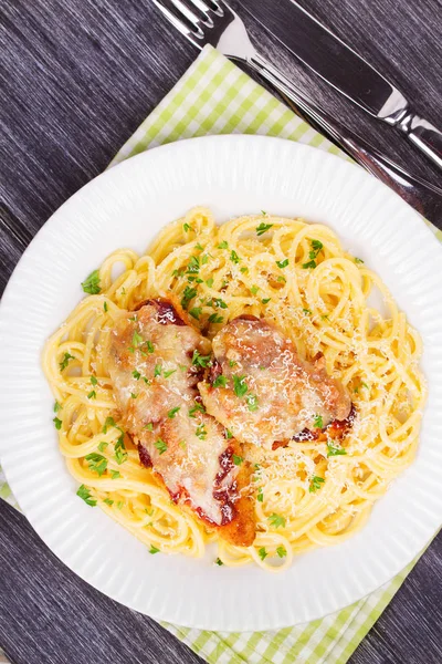 Chicken parmesan and pasta. Chicken breasts and spaghetti