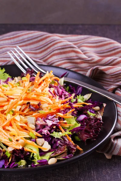 Red and white cabbage, carrot, lettuce, spring onion, nuts and seeds salad. Winter salad — Stock Photo, Image