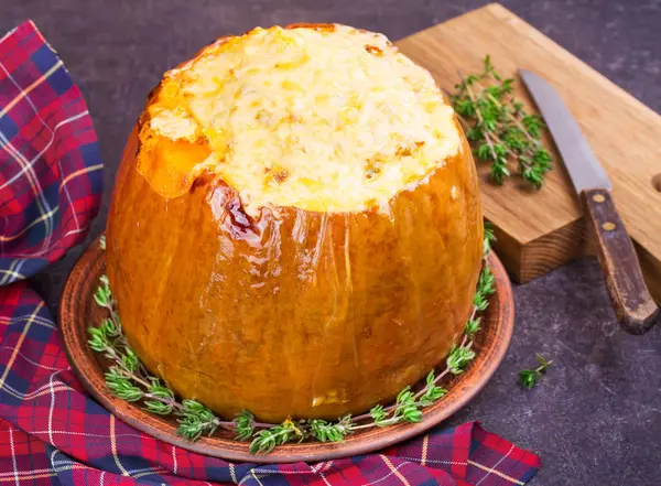 Stuffed pumpkin with meat, rice, mushrooms,  pepper and thyme. Baked butternut squash with rice — Stock Photo, Image