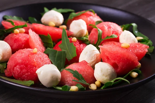 Watermelon, mozzarella and arugula salad — Stock Photo, Image