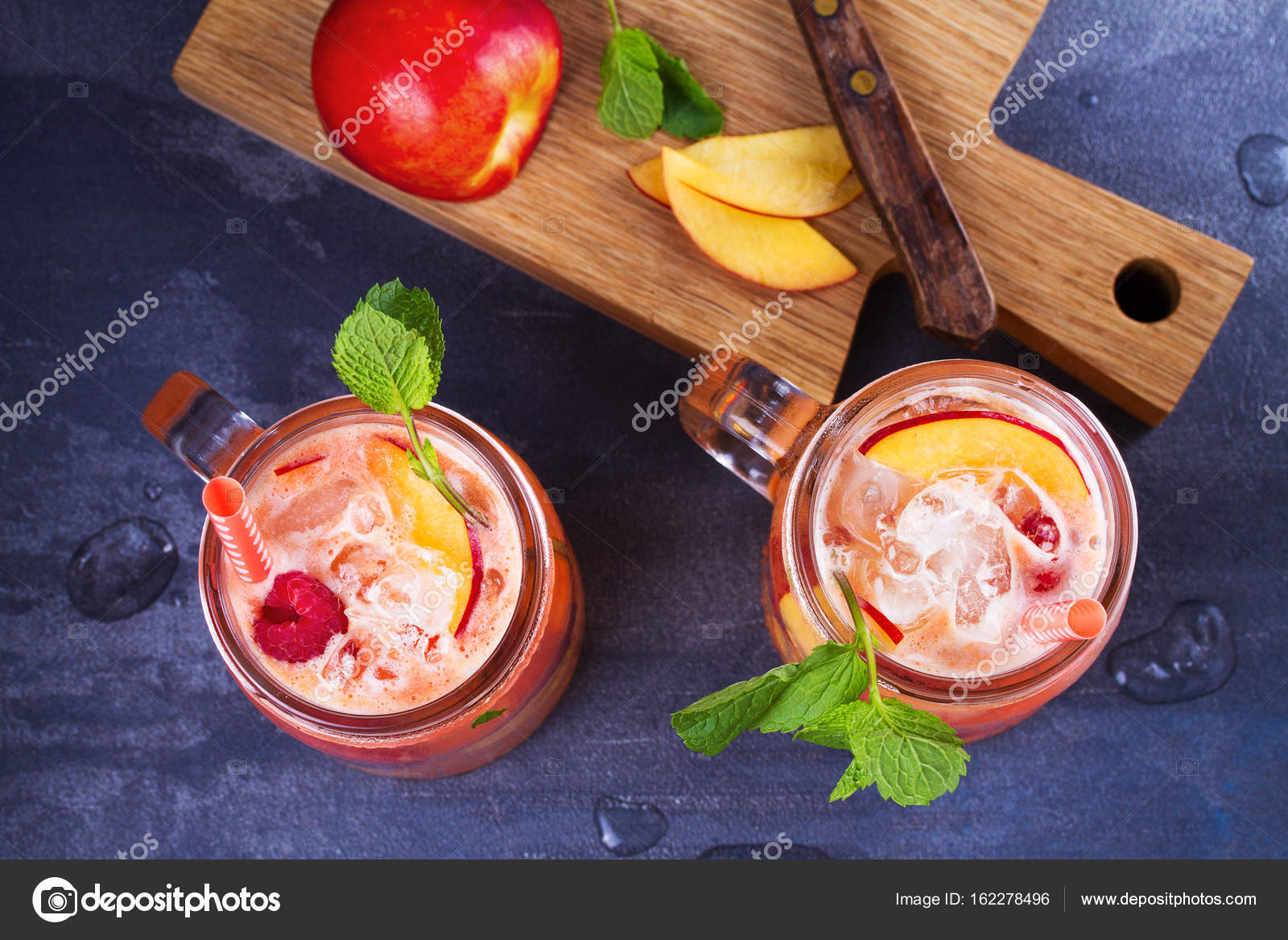 Raspberry Peach Lemonade Fruit And Berry Cocktail Stock Photo C Skylinefree 162278496