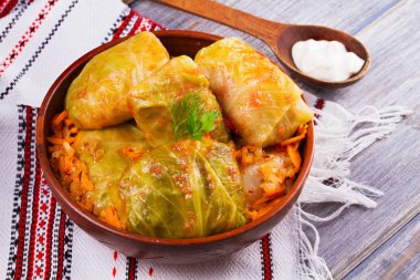Cabbage rolls with meat, rice and vegetables. Stuffed cabbage leaves with meat. Dolma, sarma, sarmale, golubtsy or golabki - traditional and popular dish in many countries clipart