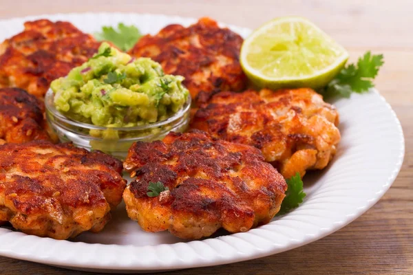 Salmon burgers with avocado salsa