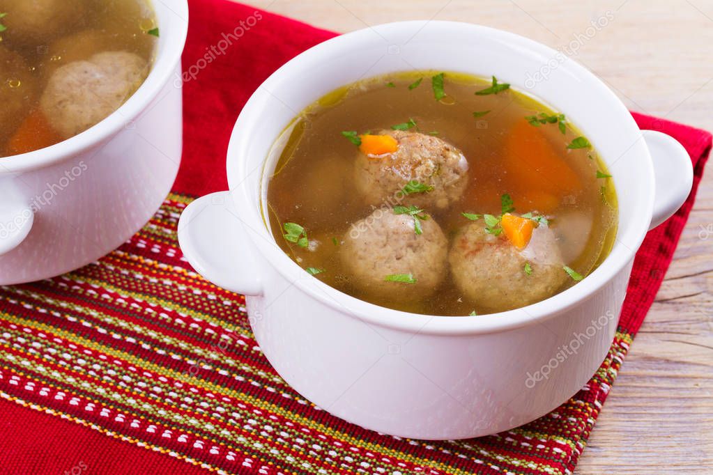 Broth with meatballs. Meatball soup
