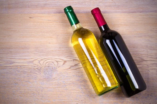 Bottle of wine on rustic wooden background. — Stock Photo, Image