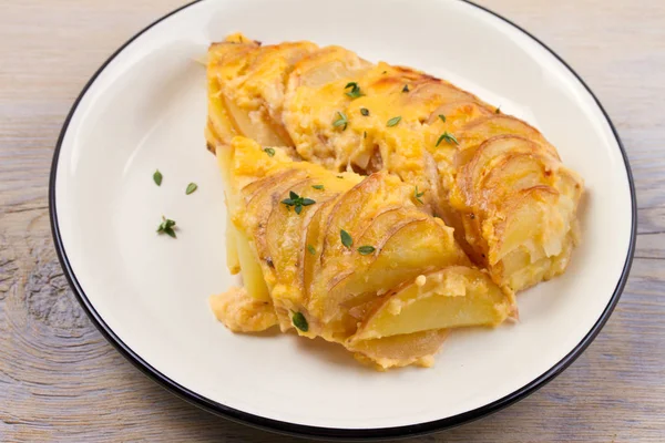 Potato gratin. Baked potato slices with creamy sauce. horizontal