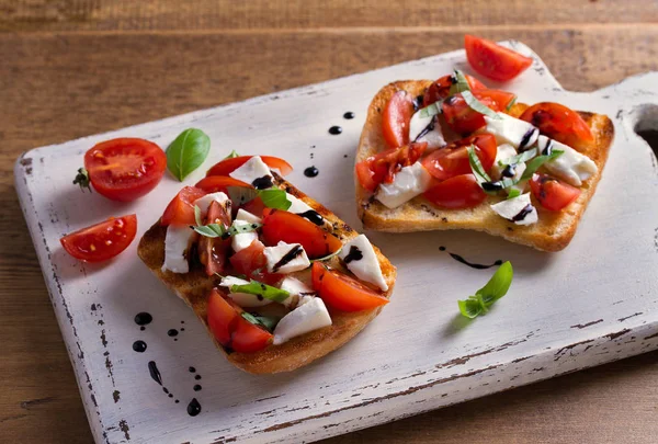 Caprese Bruschetta Tomatoes Basil Mozzarella Cheese Balsamic Reduction Drizzle Toast — Stock Photo, Image