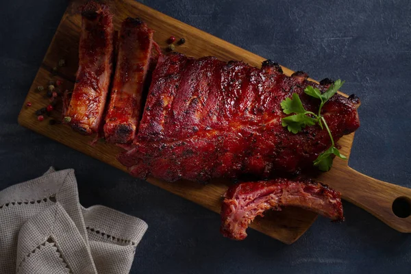 Rack of ribs with barbecue sauce. Overhead horizontal image