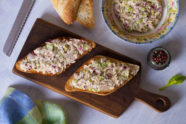 Tuna salad sandwiches on serving board. Healthy nutrition food. View from above, top view