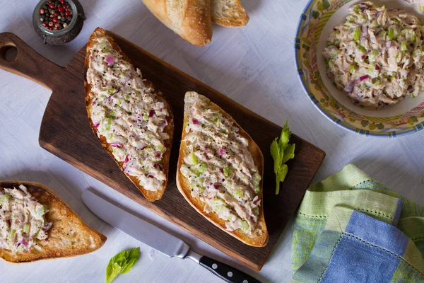 Tuna salad sandwiches on serving board. Healthy nutrition food. View from above, top view