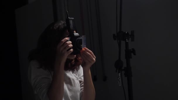 Young Girl Photographer Works Studio Takes Pictures Big Black Camera — Stock Video