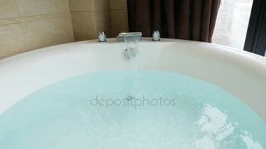 bathtub full of hot tub water