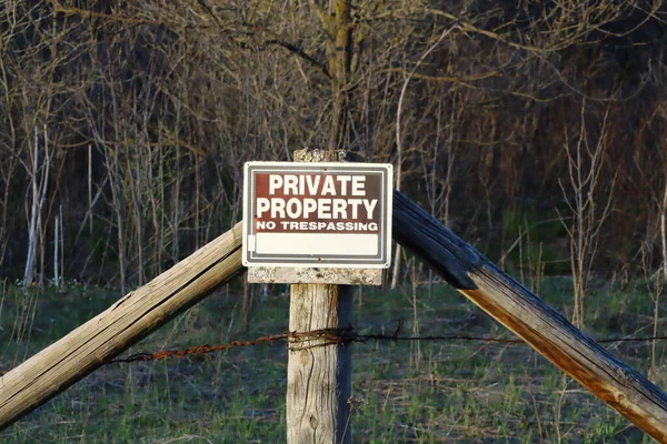 Private Property sign posted for rural wooded property