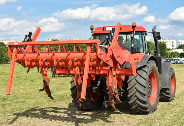 Tractor with plow machinery — Stock Photo, Image