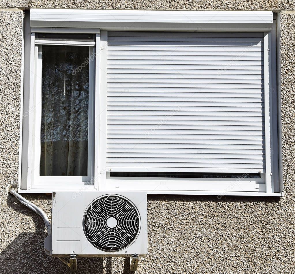 Air conditioner next to a window